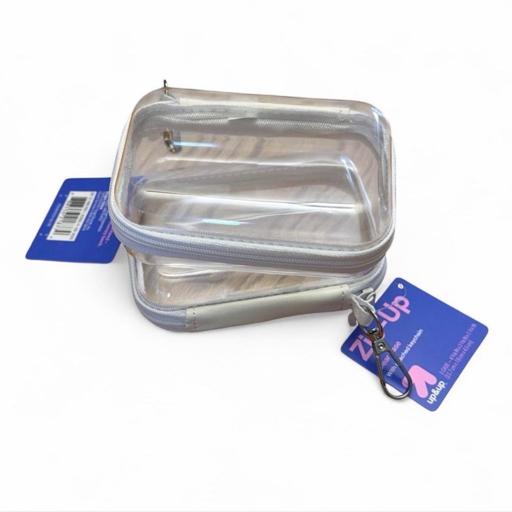 Pair of VIRAL mini Target white zip-up clear cases with attached keychains